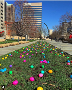 Easter Eggs on the ground with the Gateway Arch in the background