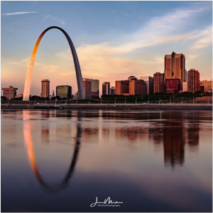Arch and St. Louis skyline reflecting in the Mississippi River