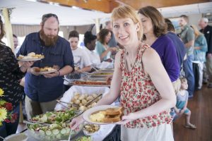 Brunch Cruise Buffet with Guests Filling up Plates.