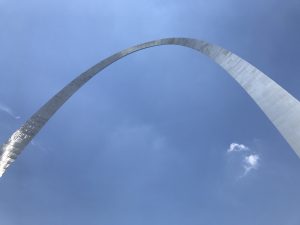 Gateway Arch photo looking up with sky in the background