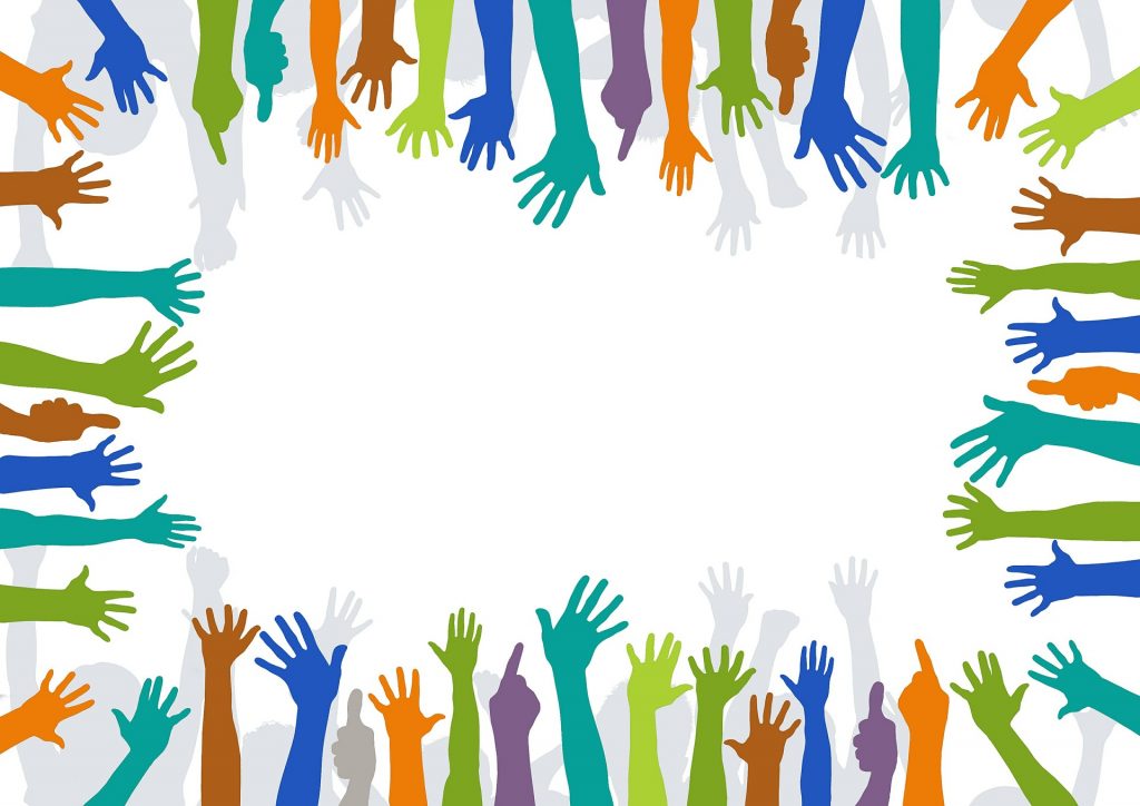 Multicolored hands outlining a blank center.