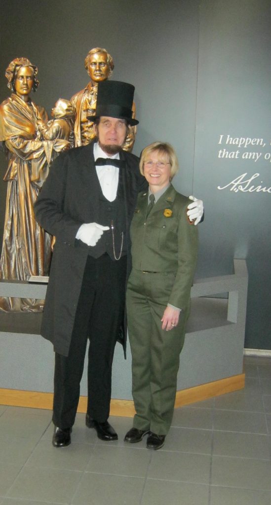 Ranger Pam Sanfilippo posing in her National Park Service uniform.