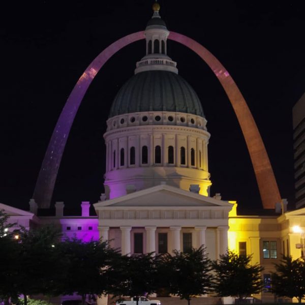 Las Vegas' sparkling purple arches contrast the one in St. Louis