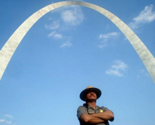 park ranger in front of the Arch