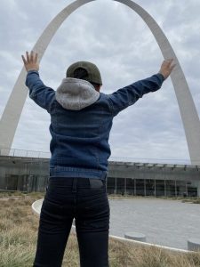 young child in front of the Arch
