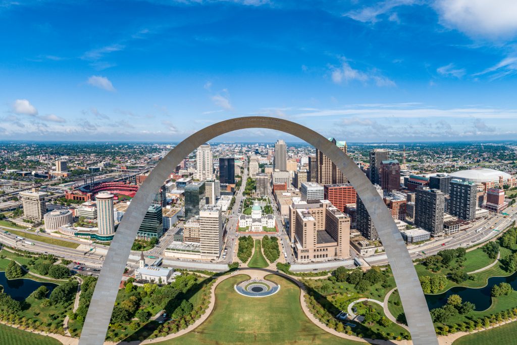 Drone picture from near the top of the Gateway Arch with the STL skyline in the background