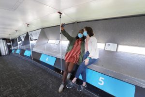 two young adult females taking a selfie at the top of the Arch