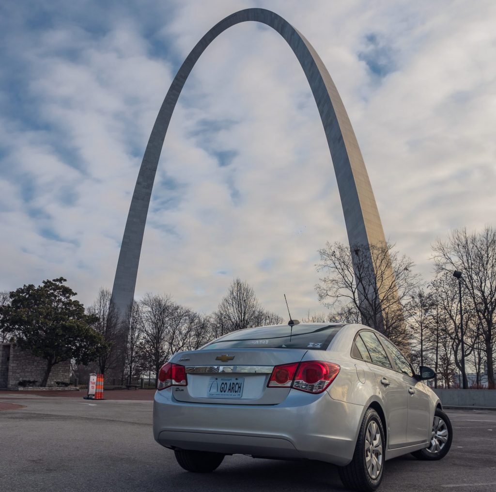 Gateway Arch with car in foreground featuring Arch license plate