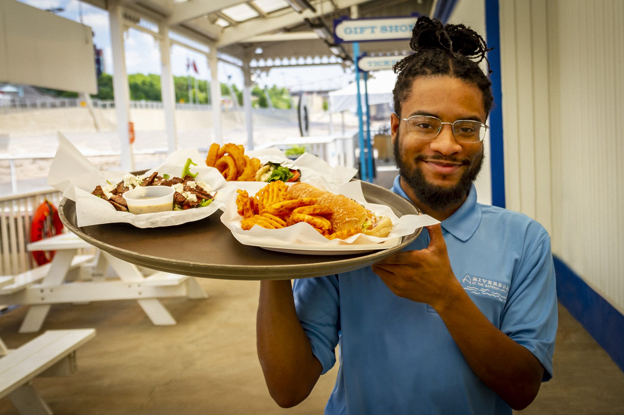 Waiter holding a tray of food