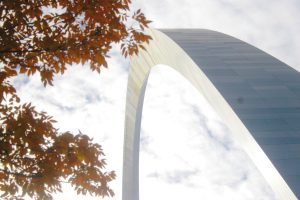 Gateway Arch monument with tree in foreground