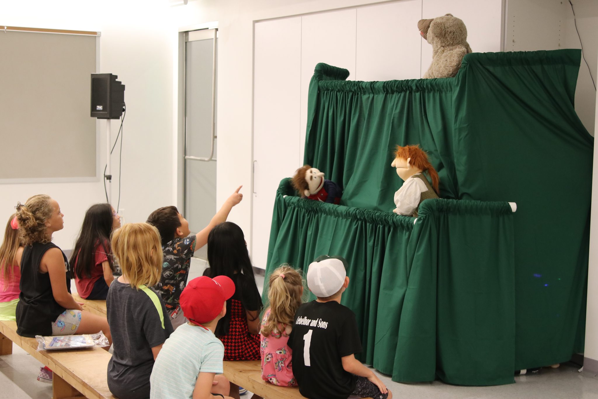 National Park Service Rangers put on a puppet show for a group of children inside the Education Center at Gateway Arch National Park. (Photo provided by NPS)