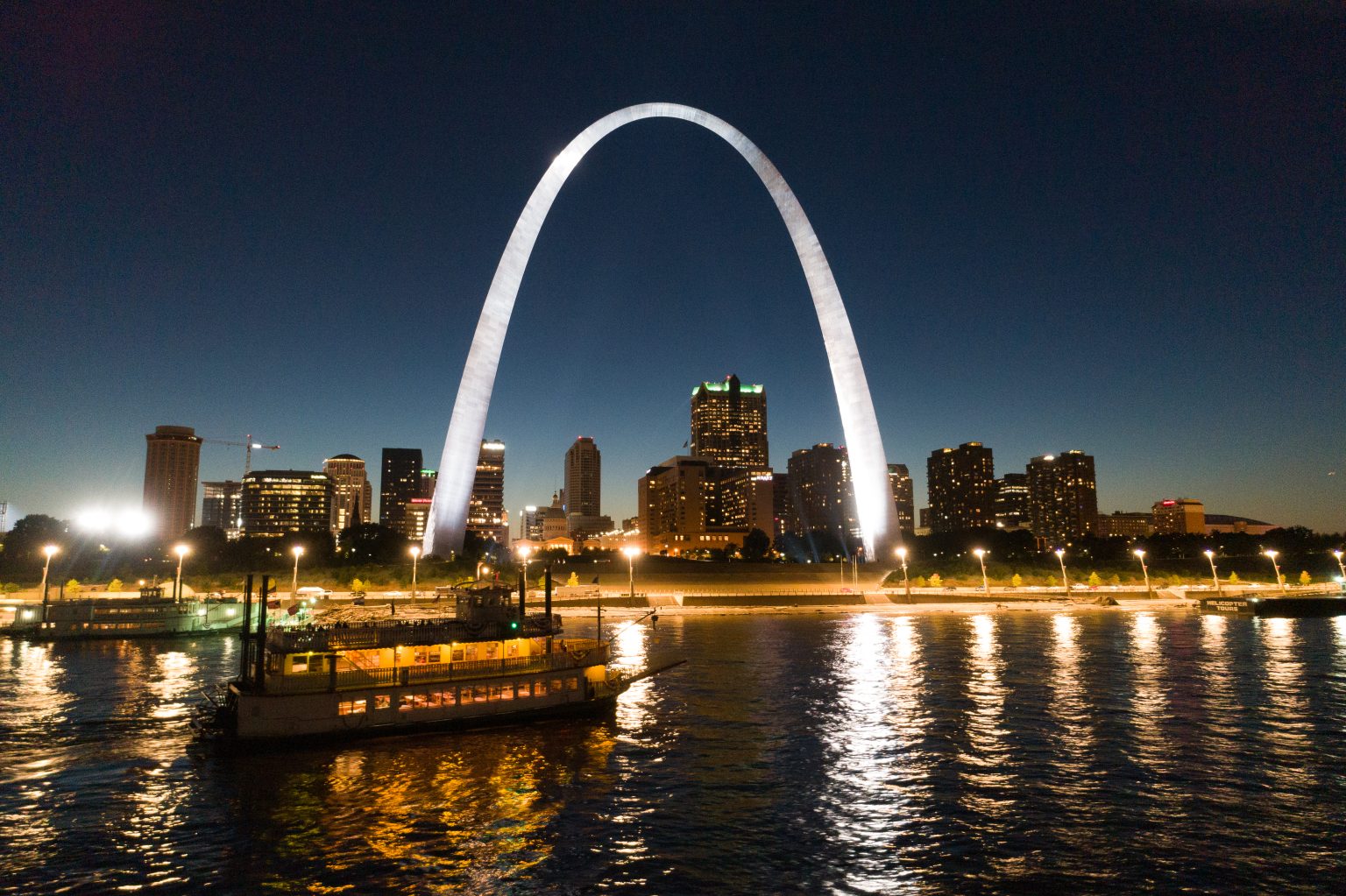 The Becky Thatcher riverboat cruises at night along the Mississippi