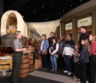 A Gateway Arch National Park Ranger speaks to a group inside the Museum at the Gateway Arch.