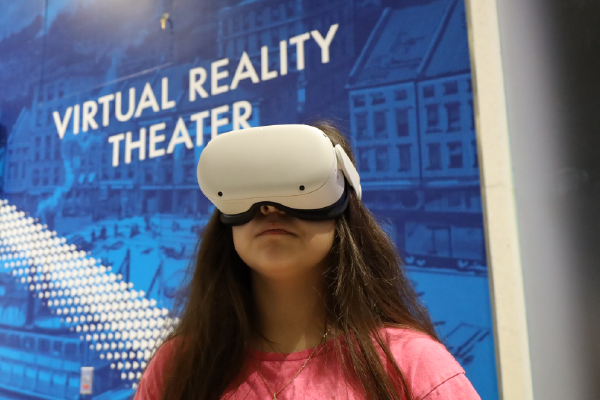 Teenage girl in Virtual Reality headset
