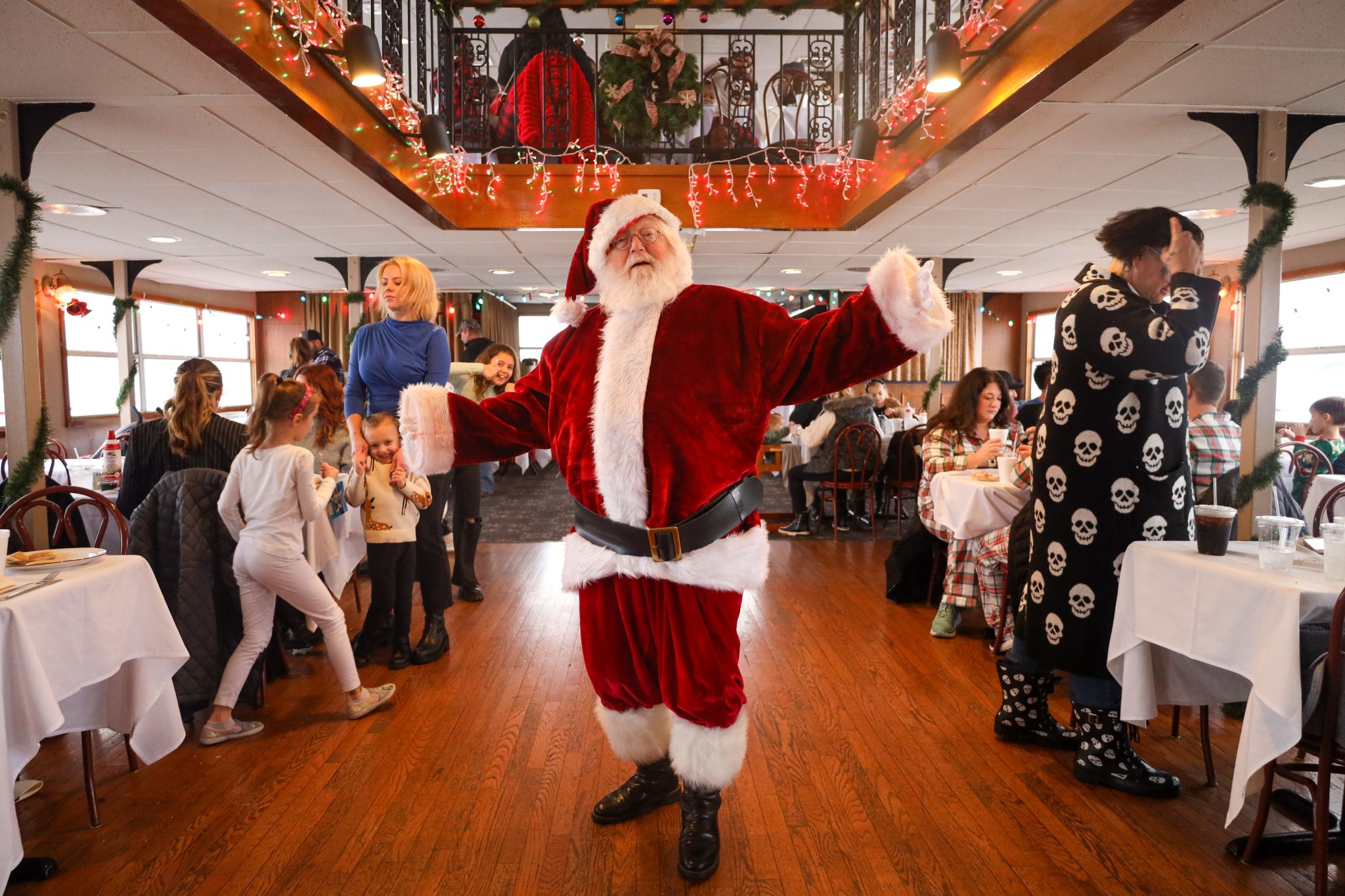 Santa Claus poses for a photo on the Riverboats at the Gateway Arch during a PJs and Pancakes Cruise.