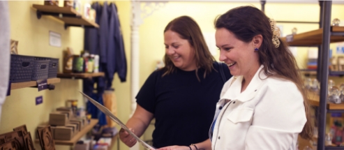 Two women shopping in the Riverboat Gift Shop.