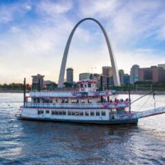 Riverboat on the Mississippi River with the St. Louis skyline behind it.