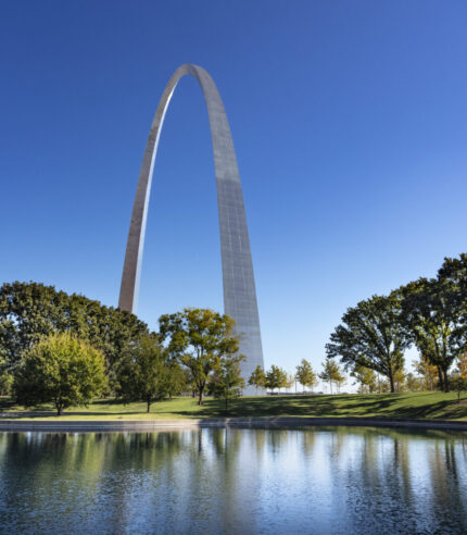 Wide shot of the Gateway Arch with the south reflection pond in foreground.