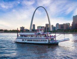 Riverboat on the Mississippi River with the St. Louis skyline behind it.