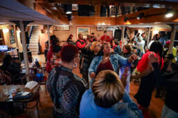 A crowded dance floor during a performance by Skeet Rodgers on a Blues Cruise