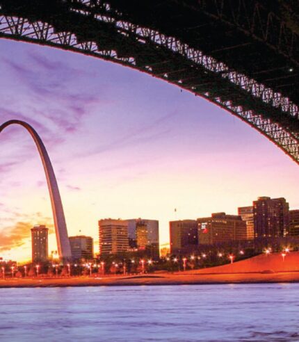 The Eads bridge borders the top of the image with the Gateway Arch in the back ground.