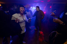 People in Halloween costumes dance to a DJ during the Halloween Costume Cruise on the Riverboats at the Gateway Arch.