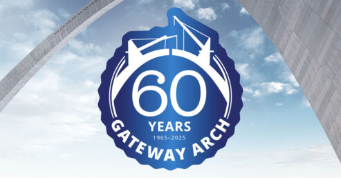 Blue seal with 60 years Gateway Arch on an image of a blue sky with the Gateway Arch in the background