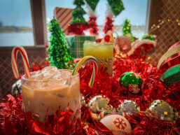 Holiday drinks from The Floating Sleigh pop-up bar displayed on with Christmas decor everywhere on the Tom Sawyer Riverboat