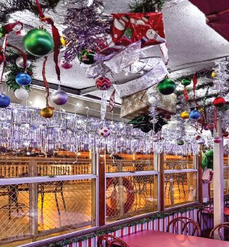 Festive decor hangs from the ceiling of The Floating Sleigh.